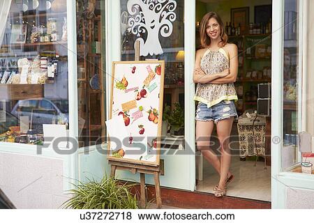 Female Owner Of Delicatessen Standing Outside Shop View Large Photo Image Stock Photo - Female Owner Of Delicatessen Standing Outside Shop. Fotosearch