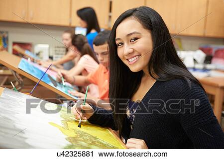 Stock Image - Female Pupil In High School Art Class. Fotosearch