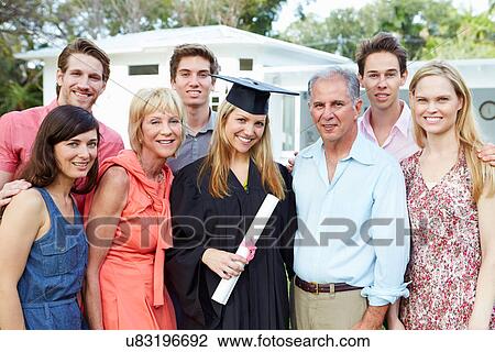 Stock Image - Female Student And Family Celebrating Graduation. Fotosearch