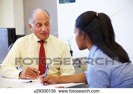 Female Student Talking To High School Counselor View Large Photo Image Stock Photography - Female Student Talking To High School Counselor. Fotosearch
