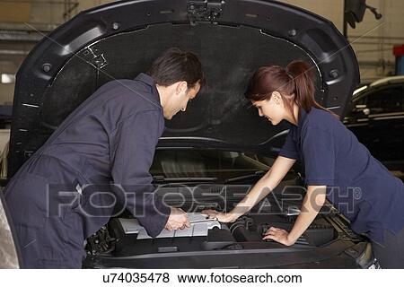 Female trainee mechanic at work View Large Photo Image Stock Photo - Female trainee mechanic at work. Fotosearch