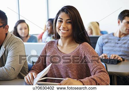 Female University Student Using Digital Tablet In Classroom View Large Photo Image Stock Image - Female University Student Using Digital Tablet In Classroom. Fotosearch