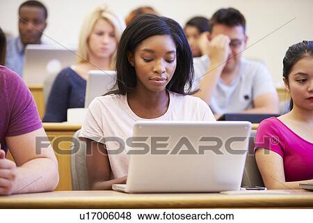 Female University Student Using Laptop In Lecture View Large Photo Image Stock Photo - Female University Student Using Laptop In Lecture. Fotosearch