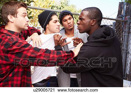 Stock Image - Fight Breaking Out Amongst Gang Members. Fotosearch