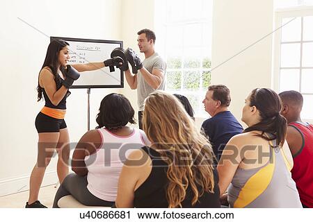 Fitness Instructor Addressing Overweight People At Diet Club View Large Photo Image Stock Image - Fitness Instructor Addressing Overweight People At Diet Club. Fotosearch