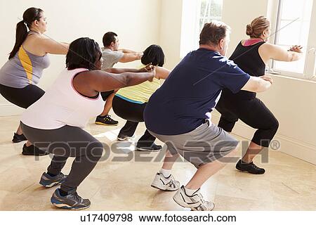 Fitness Instructor In Exercise Class For Overweight People View Large Photo Image Stock Photo - Fitness Instructor In Exercise Class For Overweight People . Fotosearch