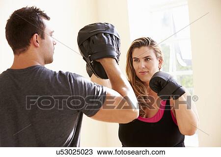 Fitness Instructor Teaching Boxing In Exercise Class View Large Photo Image Stock Image - Fitness Instructor Teaching Boxing In Exercise Class. Fotosearch