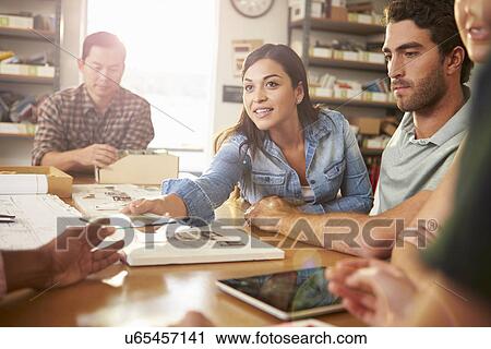 Five Architects Sitting Around Table Having Meeting View Large Photo Image Stock Image - Five Architects Sitting Around Table Having Meeting. Fotosearch