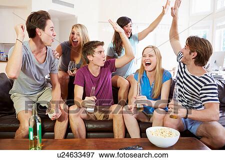 Stock Photo - Friends Watching Sport Celebrating Goal. Fotosearch