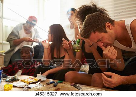 Stock Photo - Gang Of Young People Taking Drugs . Fotosearch