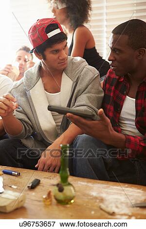 Stock Photo - Gang Of Young People With Drugs And Gun. Fotosearch