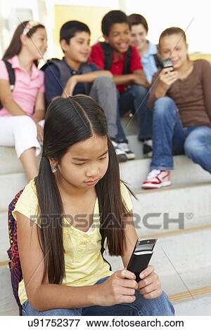 Girl being bullied in school View Large Photo Image Stock Photo - Girl being bullied in school. Fotosearch