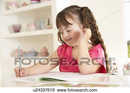 Girl with Downs Syndrome drawing View Large Photo Image Stock Photo - Girl with Downs Syndrome drawing. Fotosearch