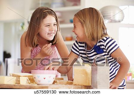Girls Eating Ingredients Whilst Making Cheese On Toast View Large Photo Image Stock Image - Girls Eating Ingredients Whilst Making Cheese On Toast. Fotosearch