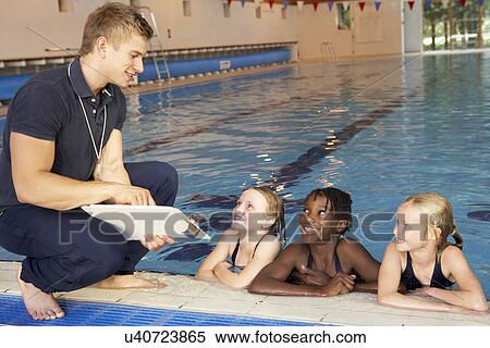 Girls having swimming lesson View Large Photo Image Stock Photography - Girls having swimming lesson. Fotosearch
