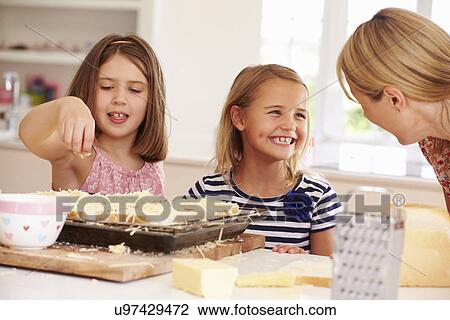 Girls With Mother Making Cheese On Toast View Large Photo Image Stock Image - Girls With Mother Making Cheese On Toast. Fotosearch