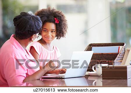 Granddaughter Helping Grandmother With Laptop View Large Photo Image Stock Image - Granddaughter Helping Grandmother With Laptop. Fotosearch