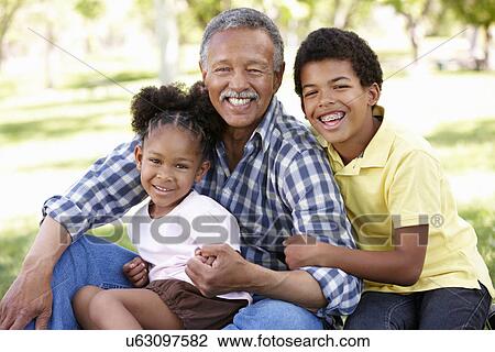Grandfather and grandchildren in park View Large Photo Image Stock Image - Grandfather and grandchildren in park. Fotosearch