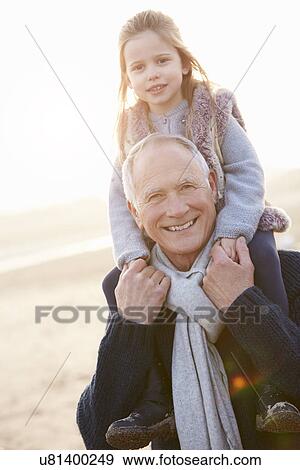 Grandfather And Granddaughter Walking On Winter Beach View Large Photo Image Stock Photo - Grandfather And Granddaughter Walking On Winter Beach. Fotosearch