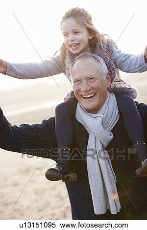 Grandfather And Granddaughter Walking On Winter Beach View Large Photo Image Stock Photography - Grandfather And Granddaughter Walking On Winter Beach. Fotosearch