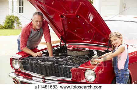 Grandfather And Granddaughter Working On Classic Car View Large Photo Image Stock Image - Grandfather And Granddaughter Working On Classic Car. Fotosearch