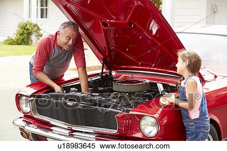 Grandfather And Granddaughter Working On Classic Car View Large Photo Image Stock Photography - Grandfather And Granddaughter Working On Classic Car. Fotosearch