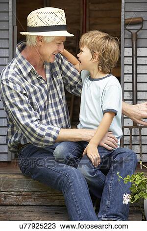 Grandfather and grandson on veranda View Large Photo Image Stock Image - Grandfather and grandson on veranda. Fotosearch