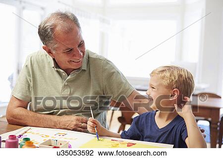 Grandfather Painting Picture With Grandson At Home View Large Photo Image Stock Image - Grandfather Painting Picture With Grandson At Home. Fotosearch