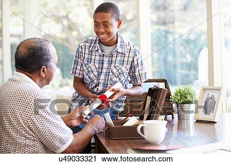 Grandfather Showing Document To Grandson View Large Photo Image Stock Image - Grandfather Showing Document To Grandson. Fotosearch