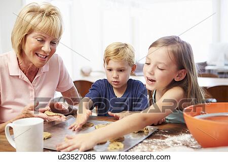 Grandmother And Grandchildren Baking Cookies Together View Large Photo Image Stock Photography - Grandmother And Grandchildren Baking Cookies Together . Fotosearch