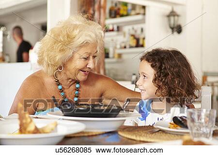 Grandmother And Granddaughter Enjoying Meal In Restaurant View Large Photo Image Stock Photography - Grandmother And Granddaughter Enjoying Meal In Restaurant. Fotosearch