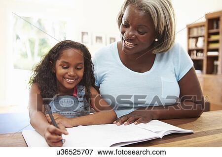Grandmother Helping Granddaughter With Homework View Large Photo Image Stock Photo - Grandmother Helping Granddaughter With Homework. Fotosearch