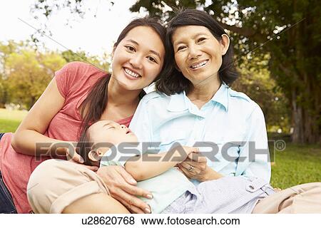 Stock Photo - Grandmother In Park With Grandson And Daughter. Fotosearch
