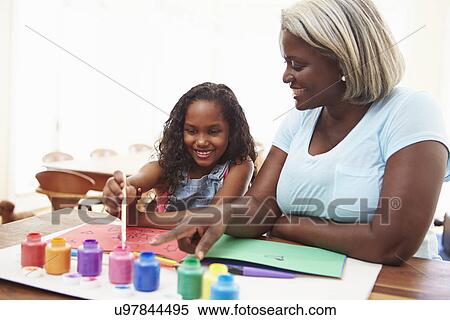 Grandmother Painting Picture With Granddaughter At Home View Large Photo Image Stock Photography - Grandmother Painting Picture With Granddaughter At Home. Fotosearch