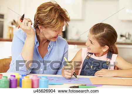 Grandmother Painting With Granddaughter At Home View Large Photo Image Picture - Grandmother Painting With Granddaughter At Home. Fotosearch