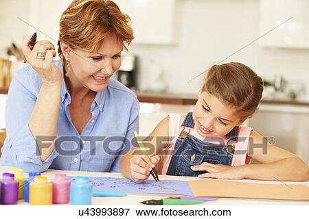 Grandmother Painting With Granddaughter At Home View Large Photo Image Stock Photo - Grandmother Painting With Granddaughter At Home. Fotosearch
