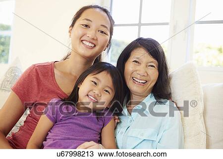Grandmother Playing On Sofa With Granddaughter And Daughter View Large Photo Image Stock Image - Grandmother Playing On Sofa With Granddaughter And Daughter. Fotosearch