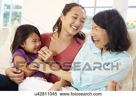 Grandmother Playing On Sofa With Granddaughter And Daughter View Large Photo Image Stock Photography - Grandmother Playing On Sofa With Granddaughter And Daughter. Fotosearch
