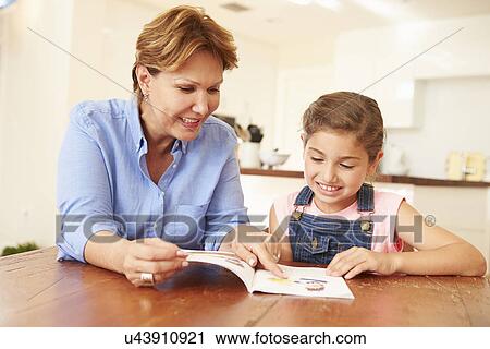 Grandmother Reading With Granddaughter At Home View Large Photo Image Stock Image - Grandmother Reading With Granddaughter At Home. Fotosearch