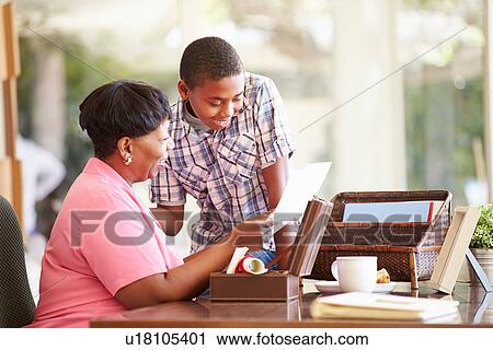 Grandmother Showing Document To Grandson View Large Photo Image Stock Image - Grandmother Showing Document To Grandson. Fotosearch