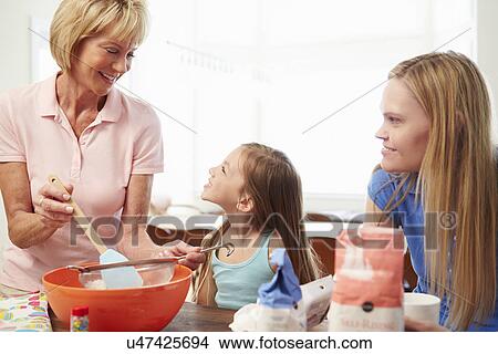 Grandmother With Granddaughter And Mother Baking Together View Large Photo Image Picture - Grandmother With Granddaughter And Mother Baking Together . Fotosearch