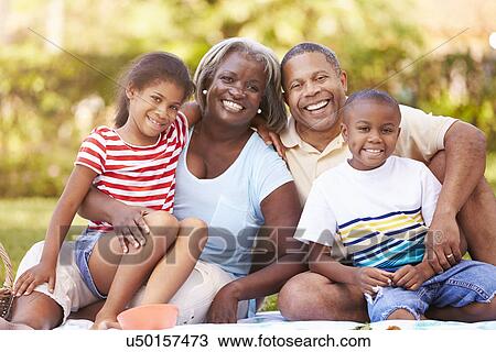 Grandparents And Grandchildren Having Picnic In Garden View Large Photo Image Stock Image - Grandparents And Grandchildren Having Picnic In Garden . Fotosearch