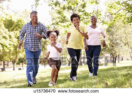 Grandparents and grandchildren in park View Large Photo Image Stock Image - Grandparents and grandchildren in park. Fotosearch