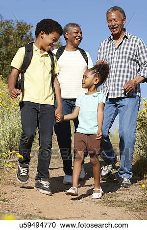 Stock Image - Grandparents and grandchildren on country hike. Fotosearch