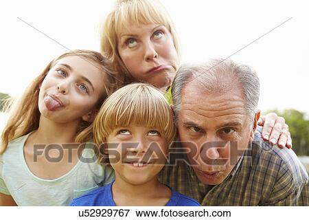 Grandparents And Grandchildren Pulling Funny Faces View Large Photo Image Stock Photo - Grandparents And Grandchildren Pulling Funny Faces. Fotosearch