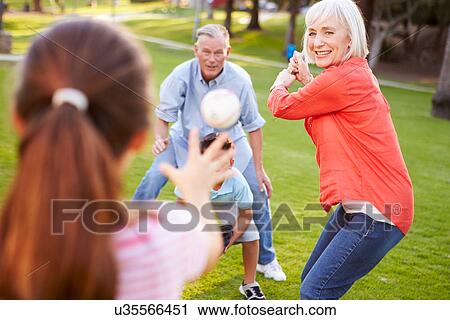Grandparents Playing Baseball With Grandchildren In Park View Large Photo Image Stock Image - Grandparents Playing Baseball With Grandchildren In Park. Fotosearch