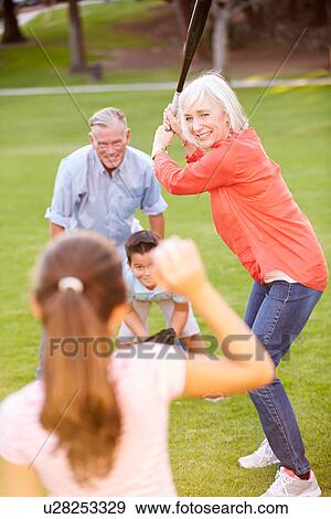 Grandparents Playing Baseball With Grandchildren In Park View Large Photo Image Stock Photo - Grandparents Playing Baseball With Grandchildren In Park. Fotosearch