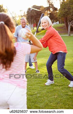 Grandparents Playing Baseball With Grandchildren In Park View Large Photo Image Stock Photo - Grandparents Playing Baseball With Grandchildren In Park. Fotosearch