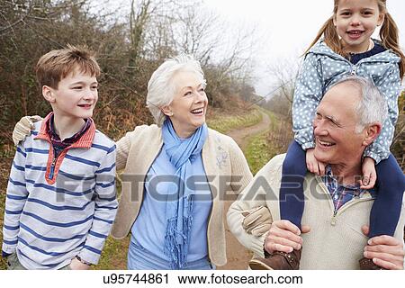 Grandparents With Grandchildren On Walk In Countryside View Large Photo Image Stock Image - Grandparents With Grandchildren On Walk In Countryside. Fotosearch