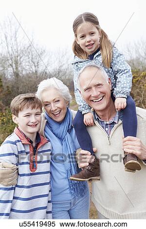 Stock Photography - Grandparents With Grandchildren On Walk In Countryside. Fotosearch